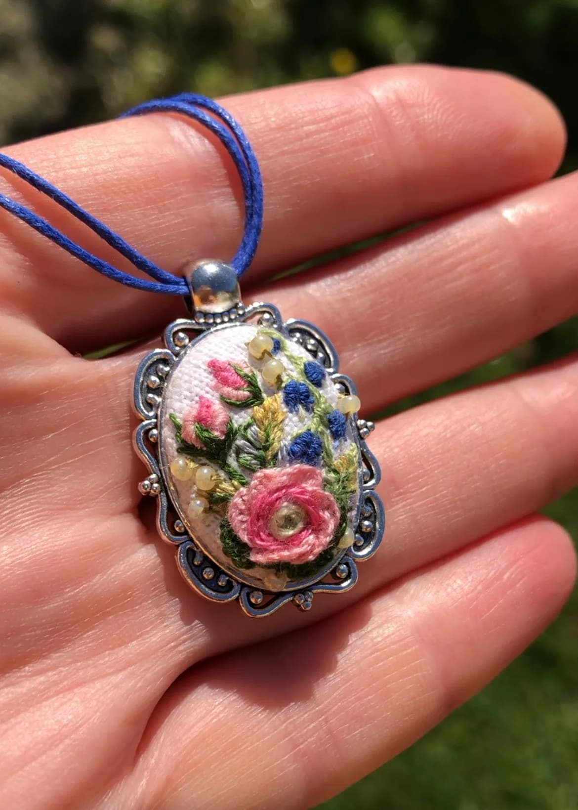 Spring Symphony — pendant shown in hand, NataSko Handmade